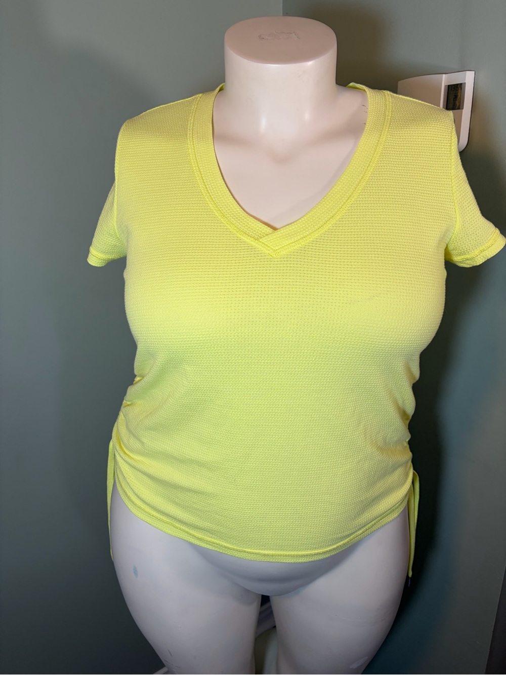 40. Calvin Klein Performance Women's V-Neck Short Sleeve Top in Neon Yellow